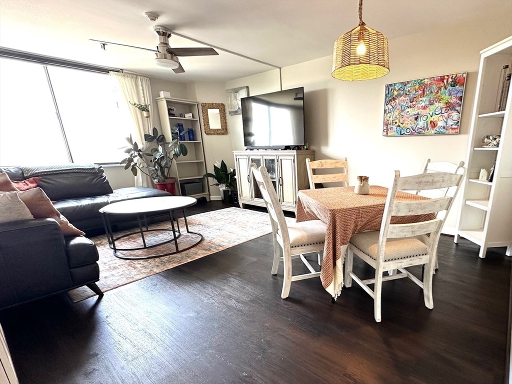 77 Adams Street, Unit 902 Quincy, MA 02169 - Photo 13 of 36 a view of a livingroom with furniture and a table