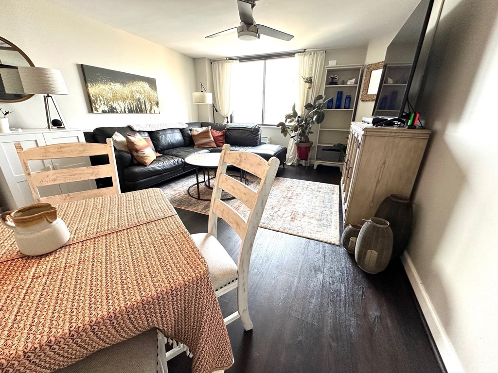77 Adams Street, Unit 902 Quincy, MA 02169 - Photo 14 of 36 a bedroom with furniture and a wooden floor