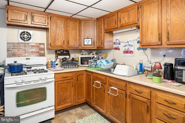 a kitchen with stainless steel appliances granite countertop a sink and cabinets