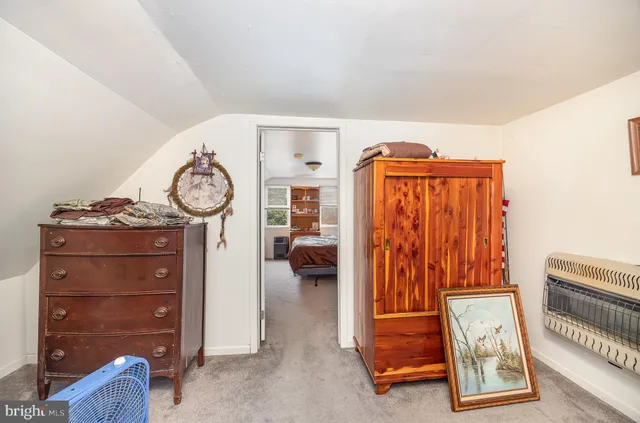 a view of hallway with stairs and closet