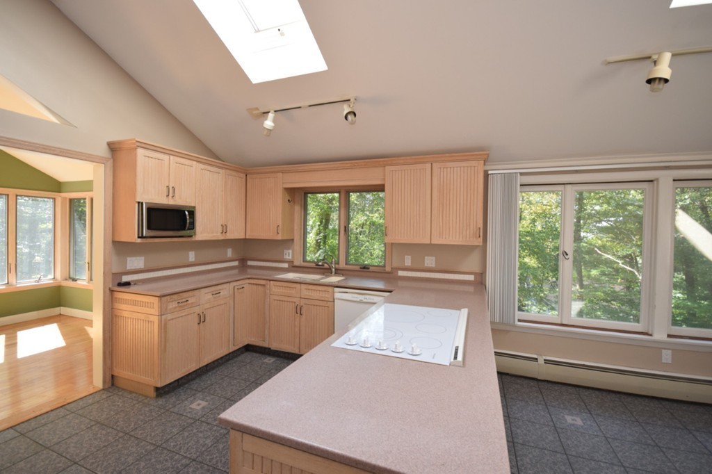 9 Ely Road Wilbraham, MA 01095 - Photo 16 of 26 a kitchen with granite countertop a stove top oven sink and cabinets