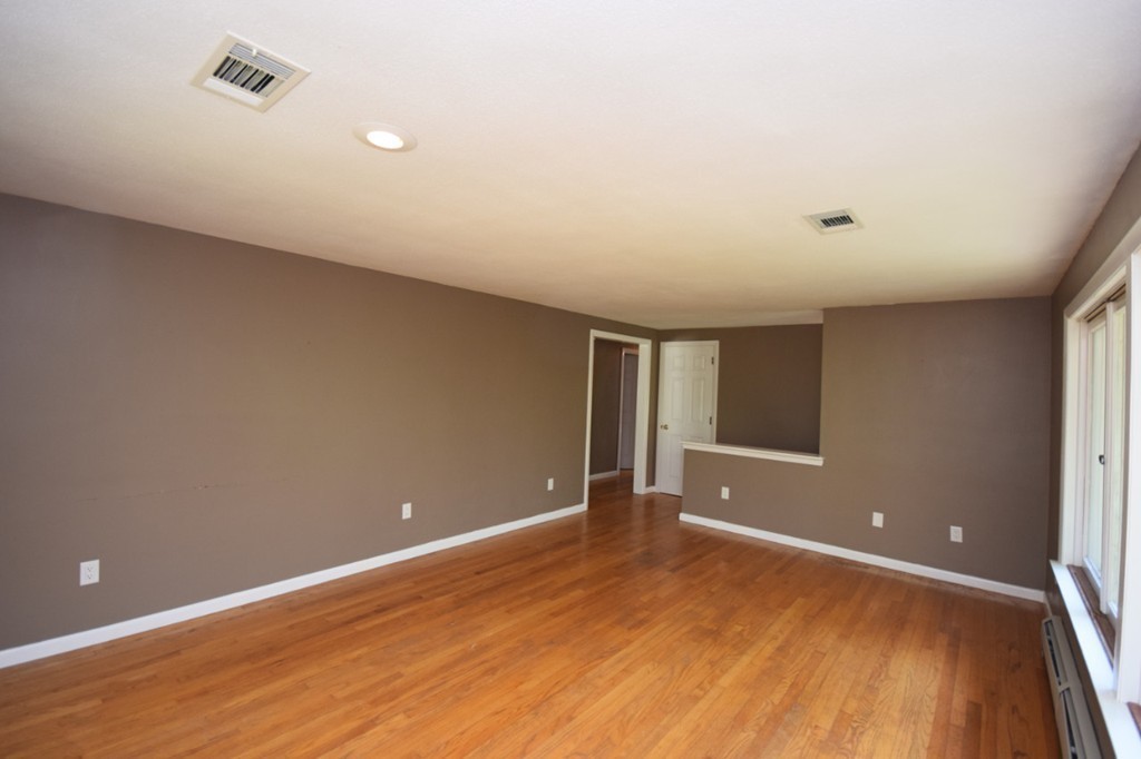 9 Ely Road Wilbraham, MA 01095 - Photo 18 of 26 a view of an empty room with wooden floor
