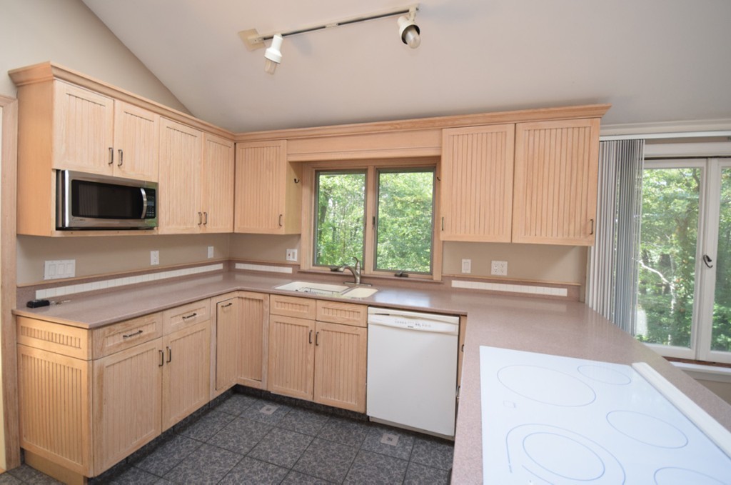 9 Ely Road Wilbraham, MA 01095 - Photo 2 of 26 a kitchen with a sink stove and microwave