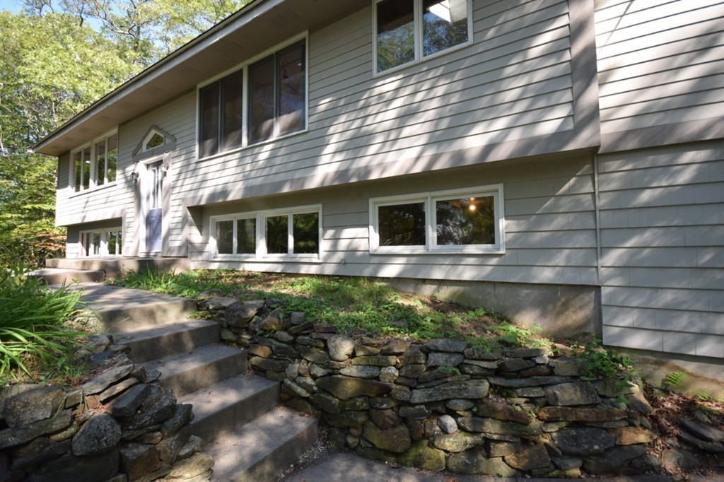 9 Ely Road Wilbraham, MA 01095 - Photo 24 of 26 a front view of a house with a yard