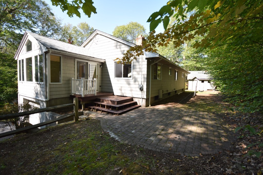 9 Ely Road Wilbraham, MA 01095 - Photo 26 of 26 a backyard of a house with table and chairs