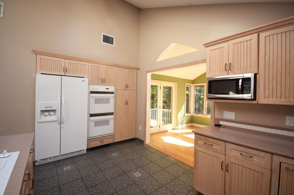 9 Ely Road Wilbraham, MA 01095 - Photo 3 of 26 a kitchen with stainless steel appliances a refrigerator and a stove top oven