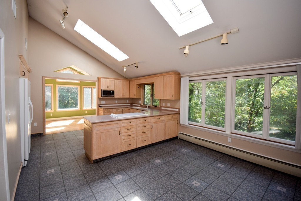 9 Ely Road Wilbraham, MA 01095 - Photo 4 of 26 a large white room with kitchen view