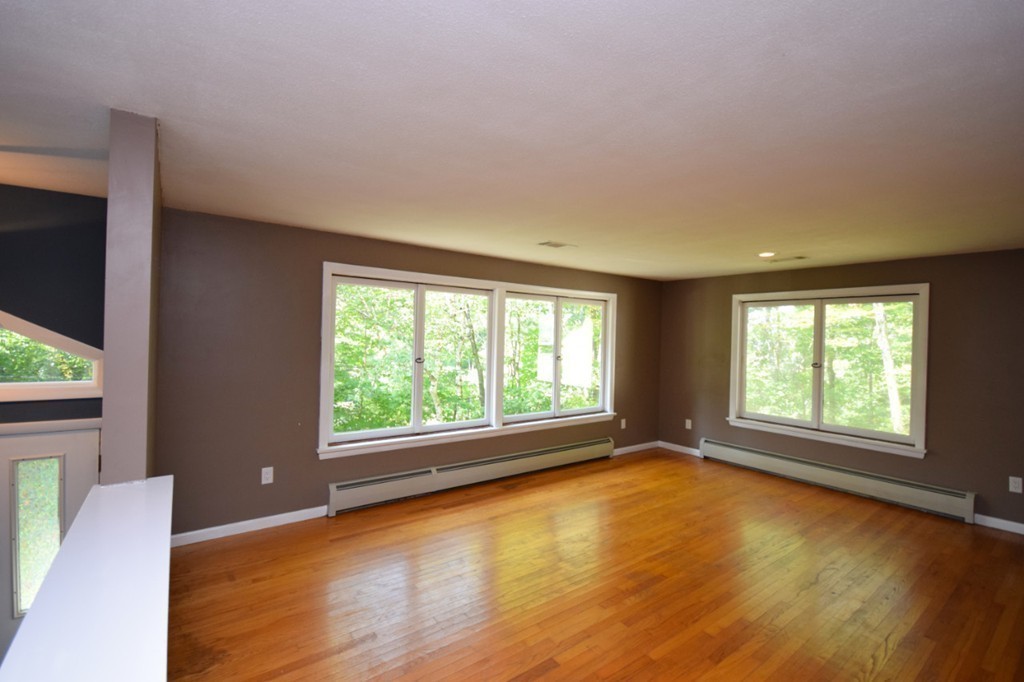 9 Ely Road Wilbraham, MA 01095 - Photo 7 of 26 a view of an empty room with wooden floor and a window