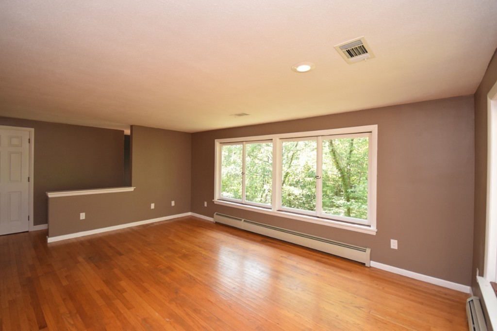 9 Ely Road Wilbraham, MA 01095 - Photo 8 of 26 an empty room with wooden floor and windows
