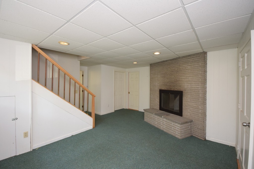 9 Ely Road Wilbraham, MA 01095 - Photo 9 of 26 a view of a livingroom with a fireplace