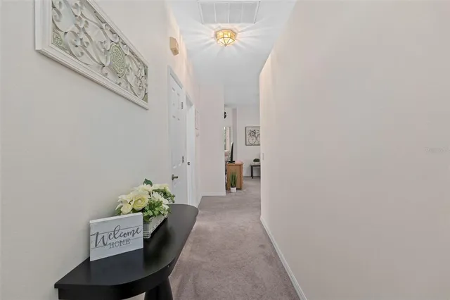a view of a hallway with seating area