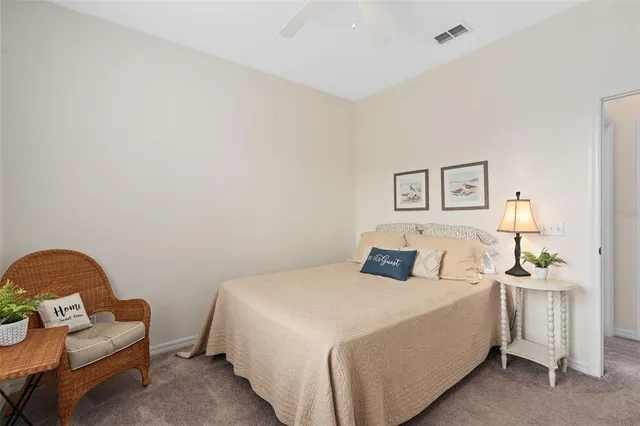 a bedroom with a bed and a couch