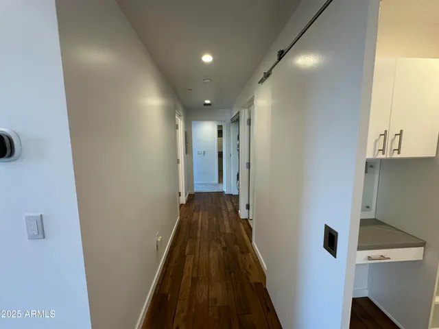 a bathroom with a shower and a sink