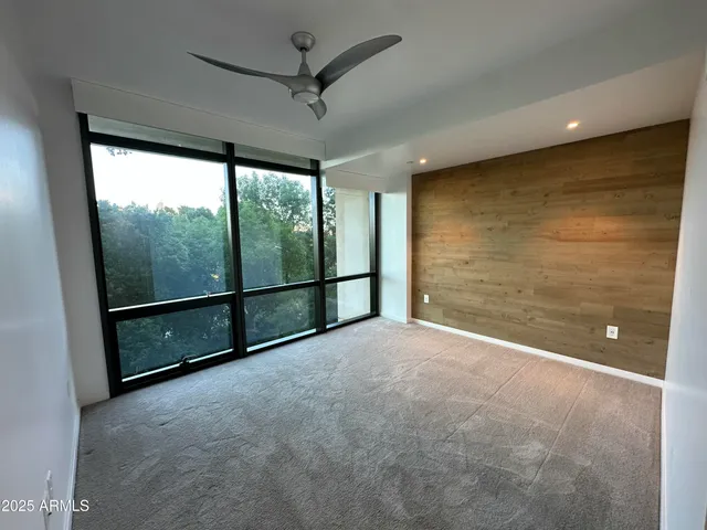a view of a patio with couches table and chairs and potted plants