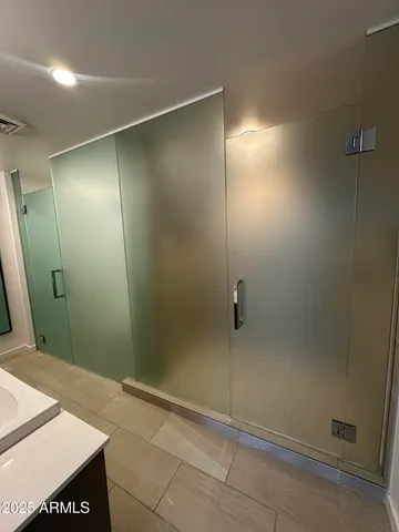 a view of a living room with furniture and window