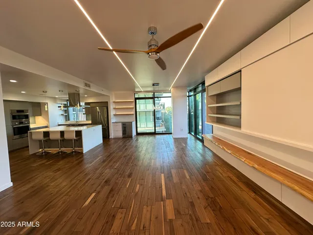 a view of a swimming pool with a table and chairs