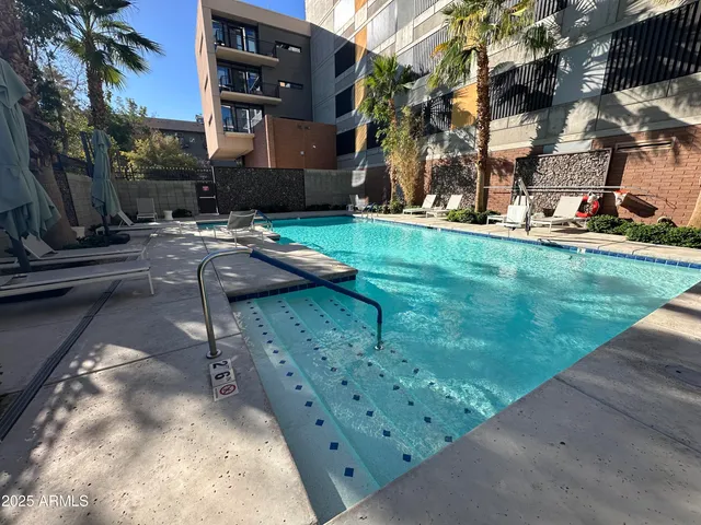 a kitchen view with wooden floor and furniture