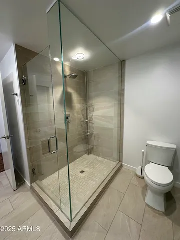 a stove top oven sitting inside of a kitchen