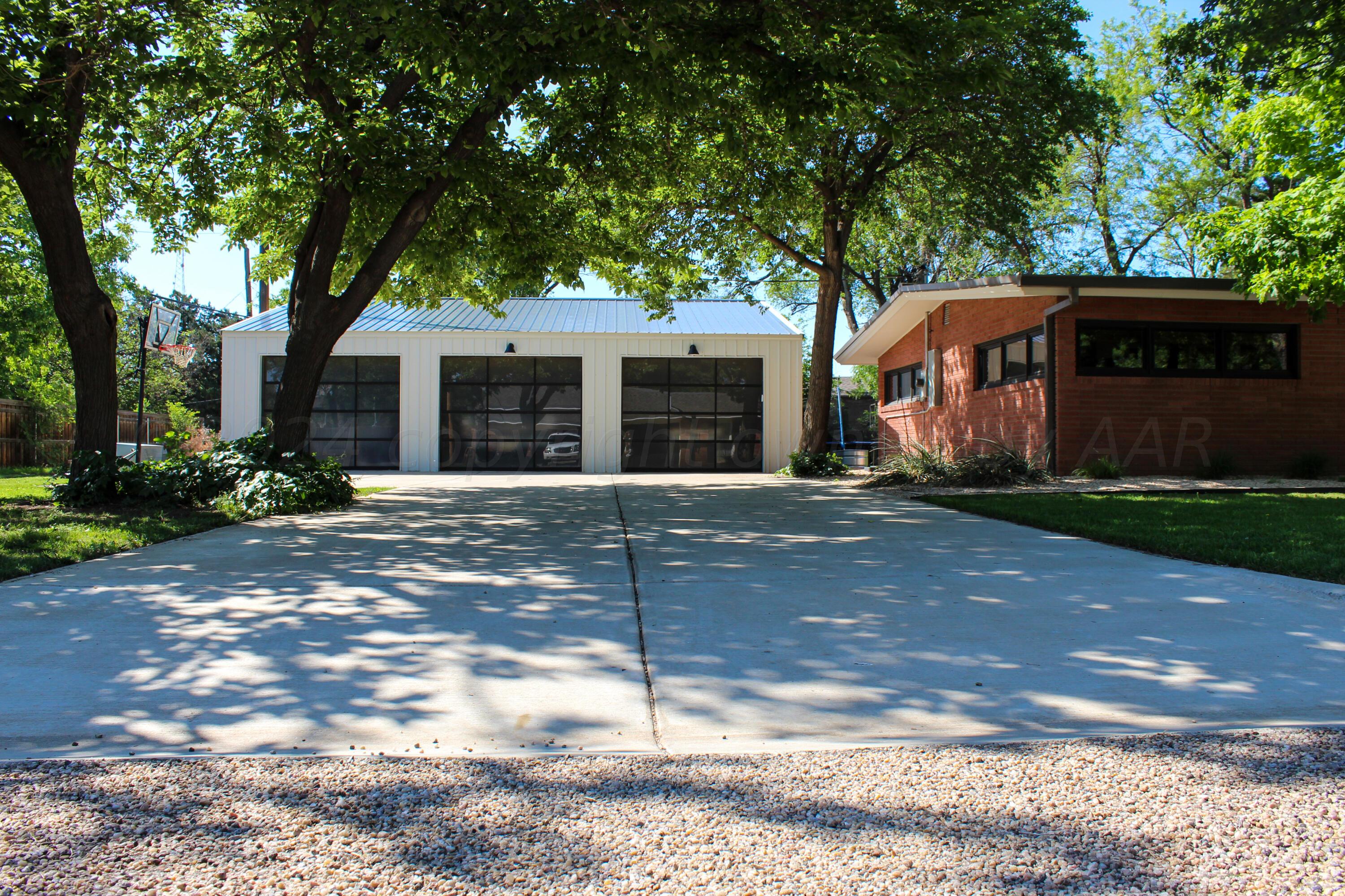 710 Park Avenue Panhandle, TX 79068 - Photo 2 of 26 a front view of a house with a yard