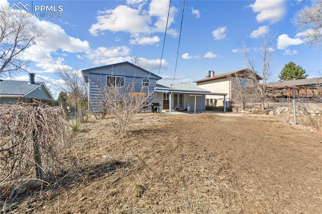 14 Duncan Road Pueblo, CO 81001 - Photo 25 of 26 Rear view of property with a covered patio