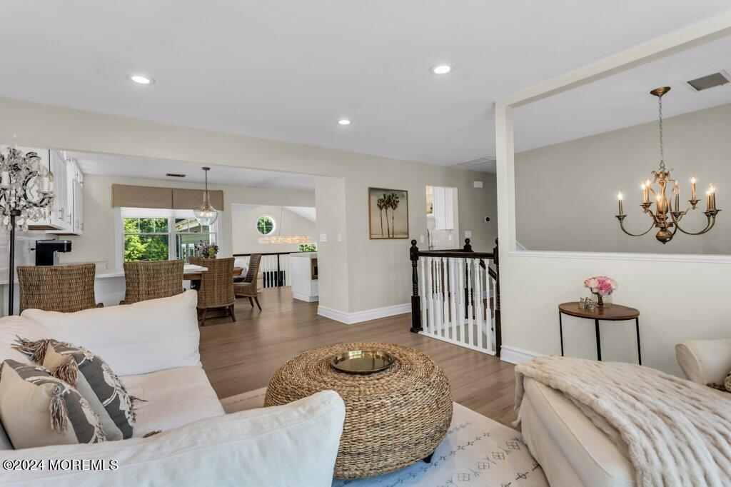 3 Ruddy Court Little Silver, NJ 07739 - Photo 12 of 55 a living room with furniture and a chandelier