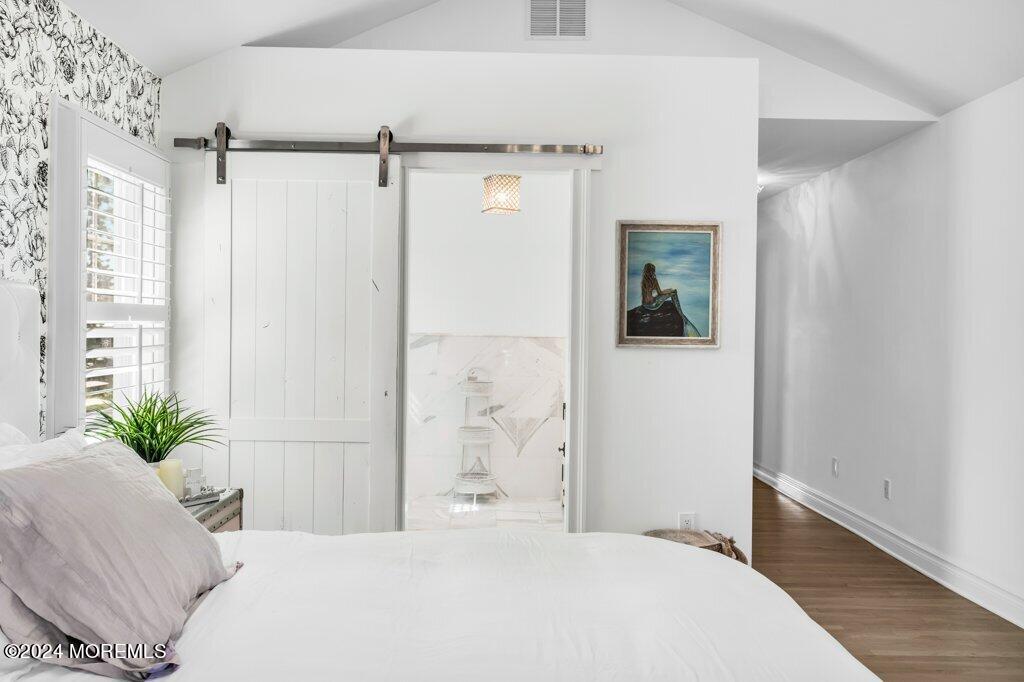 3 Ruddy Court Little Silver, NJ 07739 - Photo 19 of 55 a bedroom with a large bed and a potted plant