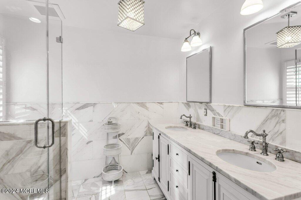 3 Ruddy Court Little Silver, NJ 07739 - Photo 23 of 55 a bathroom with a double vanity sink mirror and