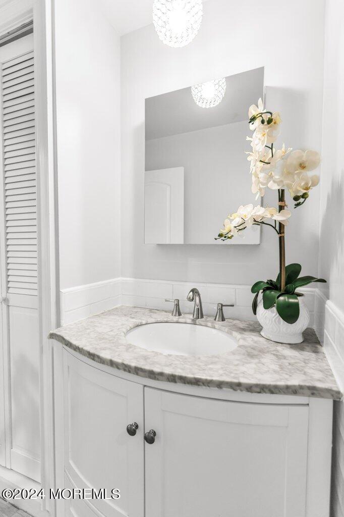 3 Ruddy Court Little Silver, NJ 07739 - Photo 29 of 55 a bathroom with a granite countertop sink a mirror and vanity