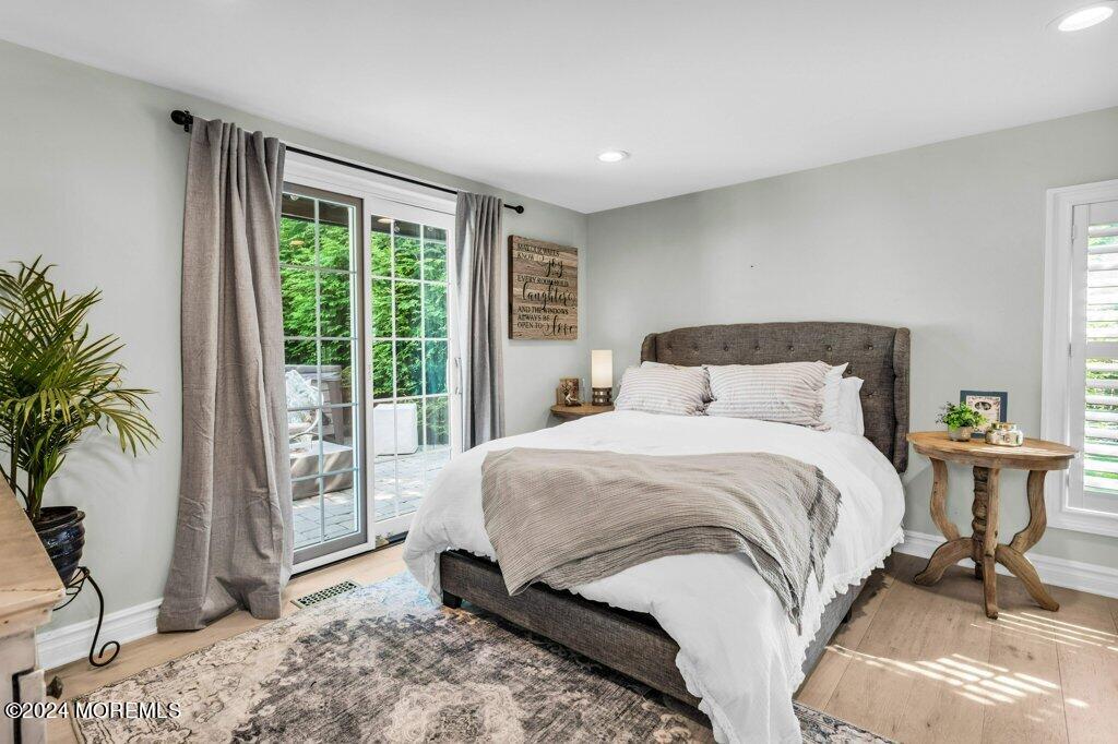 3 Ruddy Court Little Silver, NJ 07739 - Photo 30 of 55 a bedroom with a bed and large windows