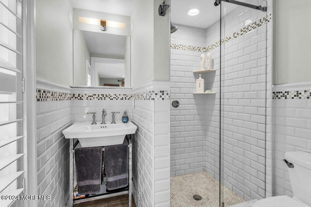 3 Ruddy Court Little Silver, NJ 07739 - Photo 32 of 55 a bathroom with a sink a shower and a mirror