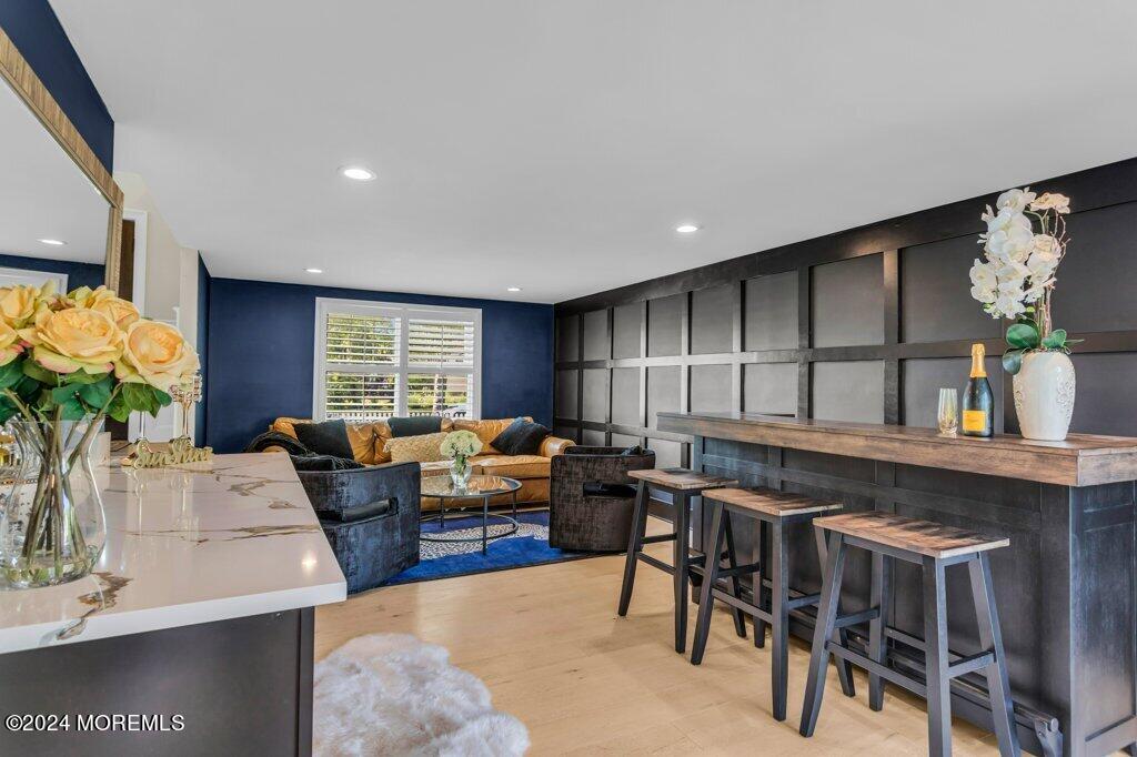 3 Ruddy Court Little Silver, NJ 07739 - Photo 37 of 55 a living room with fireplace furniture and a potted plant