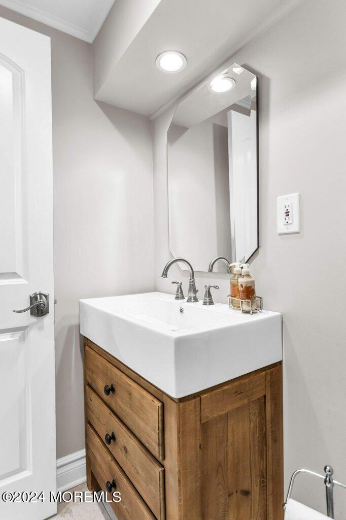 3 Ruddy Court Little Silver, NJ 07739 - Photo 39 of 55 a bathroom with a sink and a mirror