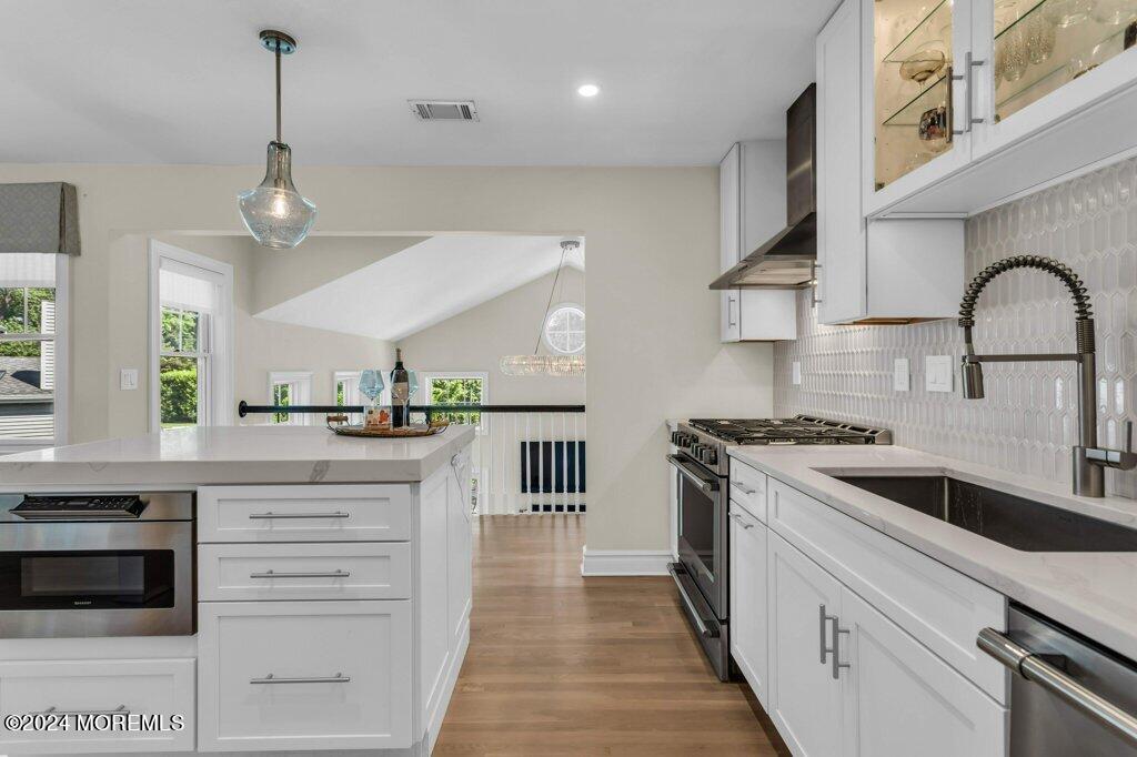 3 Ruddy Court Little Silver, NJ 07739 - Photo 6 of 55 a kitchen with stainless steel appliances granite countertop a stove a sink and a refrigerator