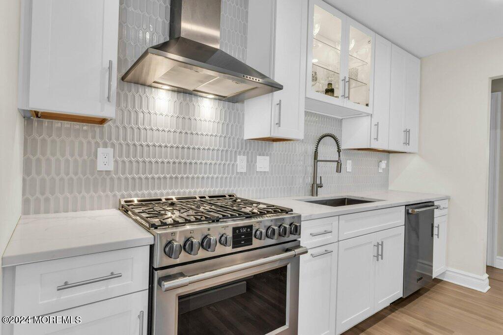 3 Ruddy Court Little Silver, NJ 07739 - Photo 8 of 55 a kitchen with granite countertop a stove and a sink