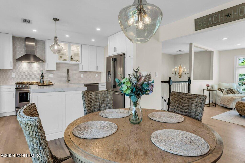 3 Ruddy Court Little Silver, NJ 07739 - Photo 10 of 55 a kitchen with stainless steel appliances granite countertop a dining table and chairs