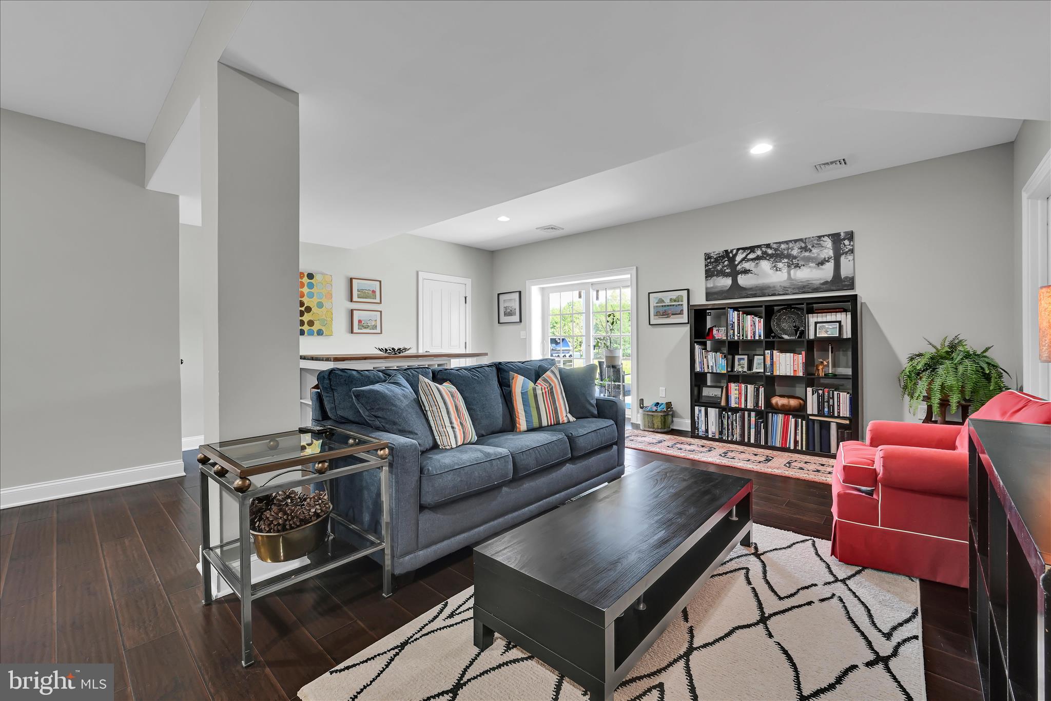 678 Integrity Drive Lititz, PA 17543 - Photo 34 of 51 a living room with furniture a rug and a bookshelf