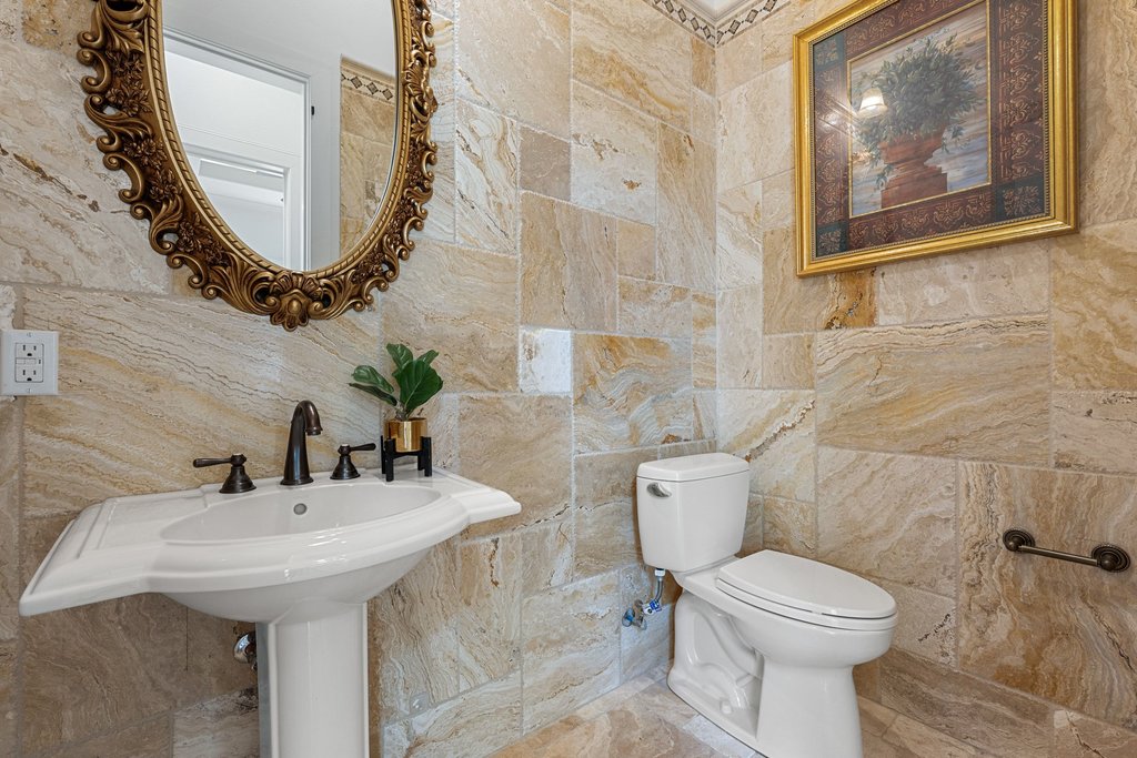 102 Long Point Cove Georgetown, TX 78628 - Photo 27 of 36 a bathroom with a sink and mirror