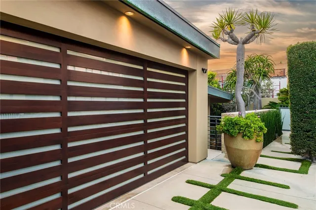 a view of a two chairs in the patio