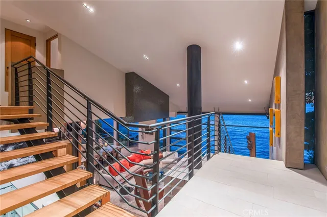 an aerial view of a house with a yard and large trees