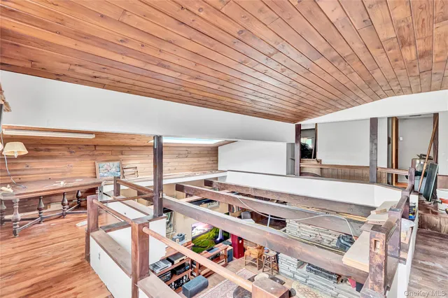 a view of a kitchen with dining table and chairs