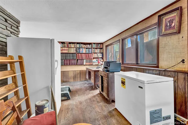 a view of living room kitchen and a stove top oven