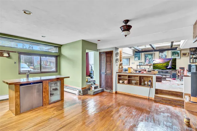 a kitchen with stainless steel appliances kitchen island granite countertop a stove and cabinets