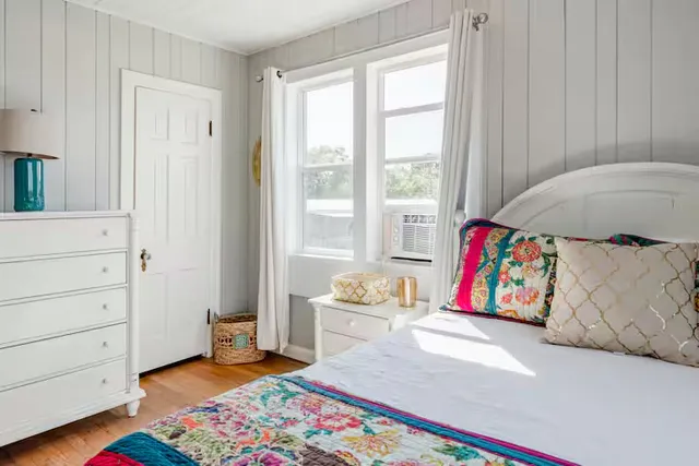 a living room with furniture and a gate