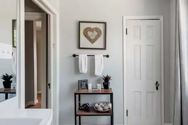 a room with cabinet and painting on the wall