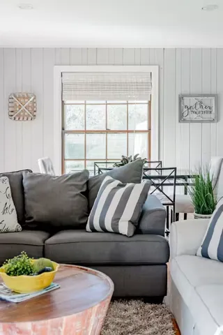 a living room with furniture and a table