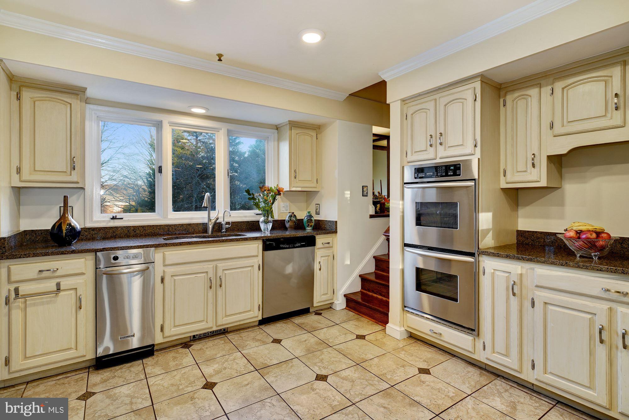 6 Travilah Terrace Potomac, MD 20854 - Photo 12 of 49 Granite Counters and Off-White Wood Cabinets