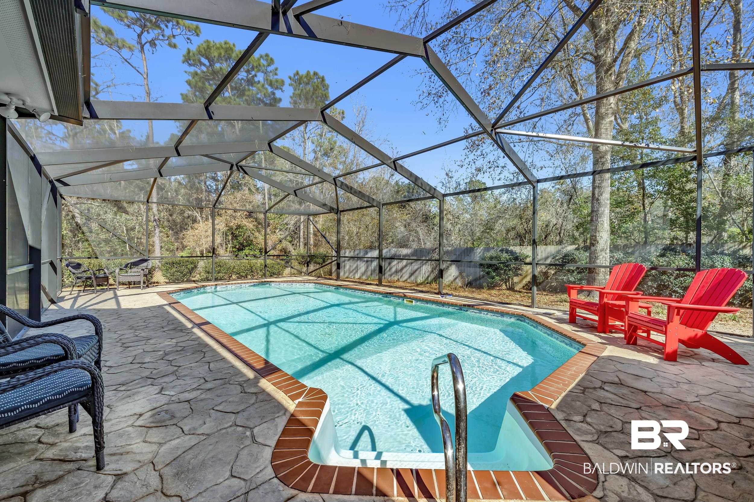 22929 Highway 98 Foley, AL 36535 - Photo 33 of 54 View of swimming pool featuring a lanai, patio surround, and a sunroom