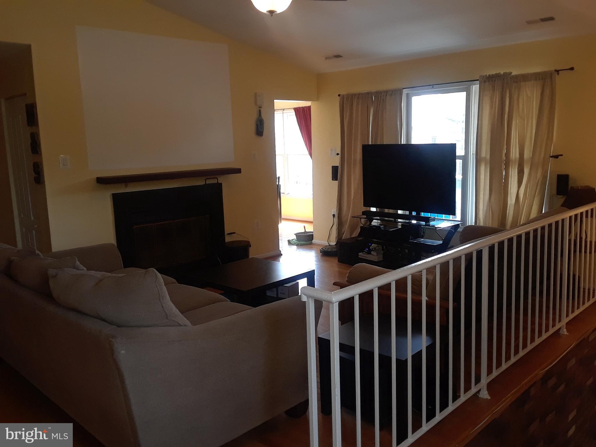 7424 Rokeby Drive, Unit 3 Manassas, VA 20109 - Photo 1 of 12 Living Room with Cozy Fireplace and Heatolator