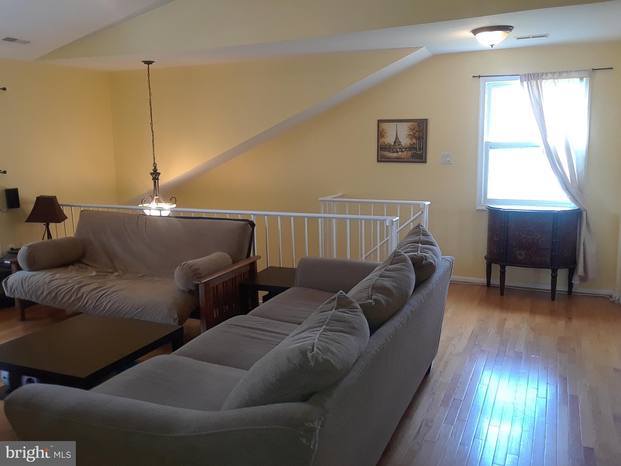7424 Rokeby Drive, Unit 3 Manassas, VA 20109 - Photo 5 of 12 Living Room w/ Beautiful Hardwood Floors