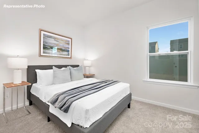 a bedroom with bed and a window